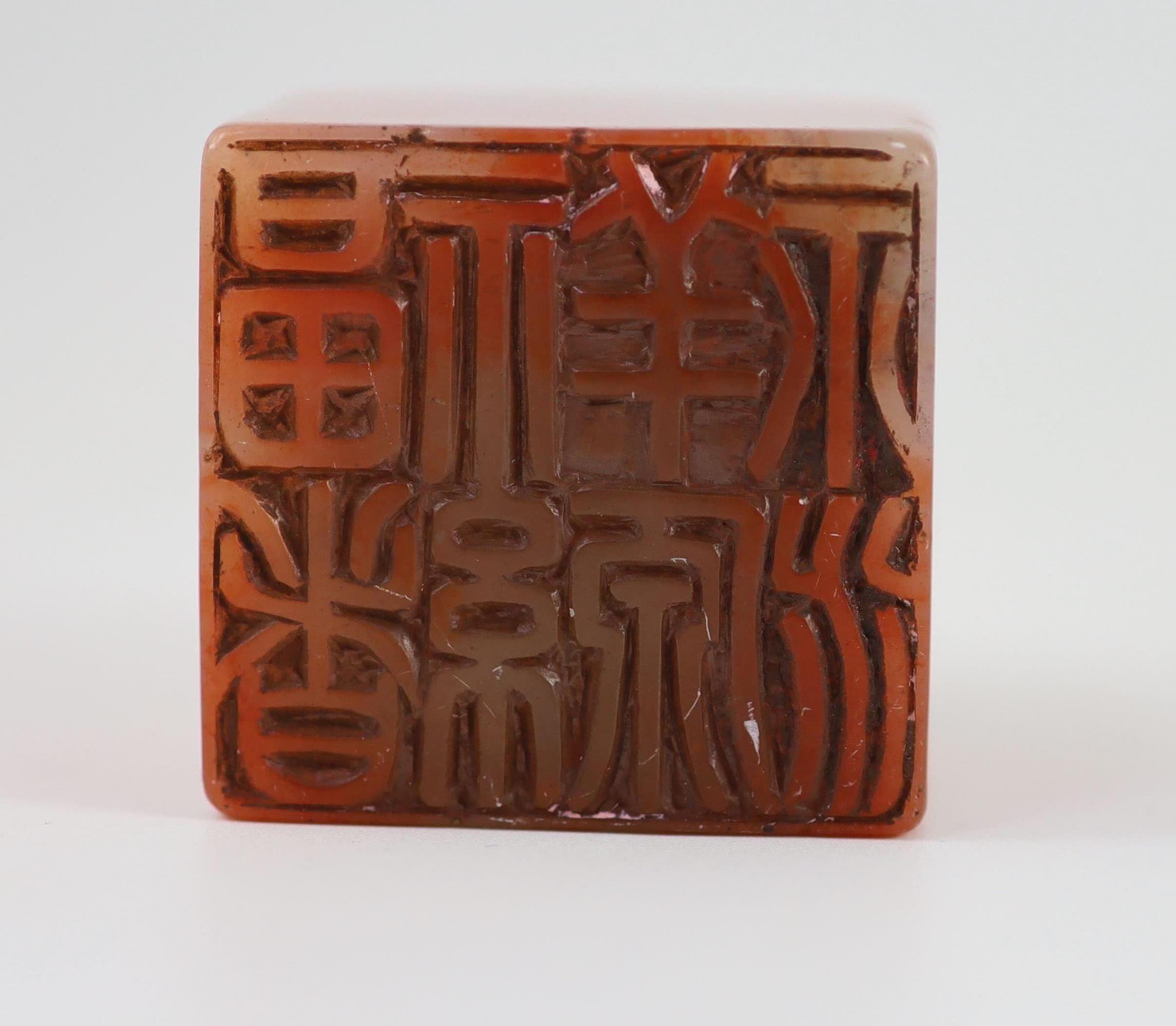 A Chinese ‘chicken’s blood’ soapstone seal, 5.5 cm high